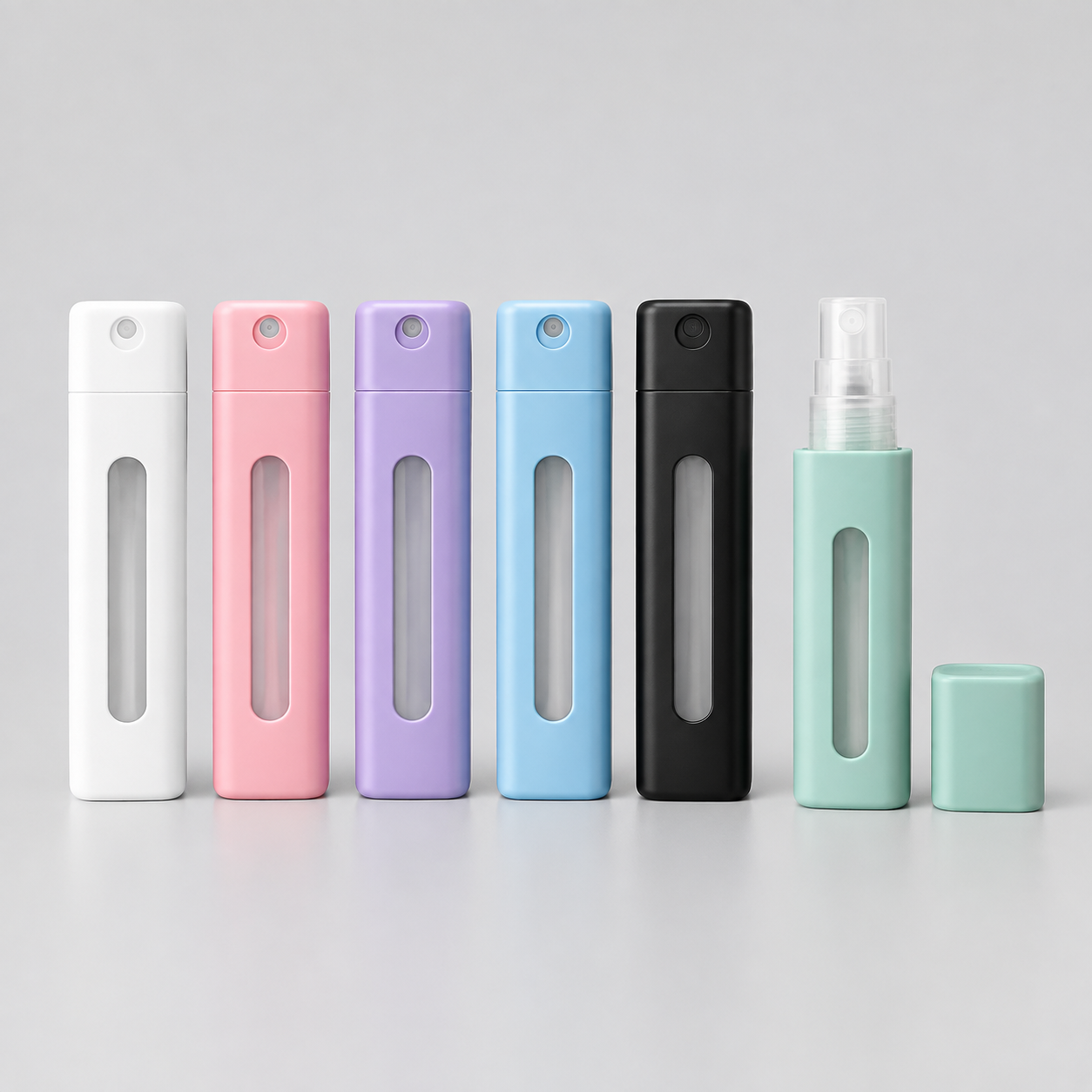 Portable flat mini spray bottles in multiple colors